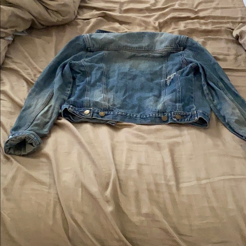Distressed denim jacket